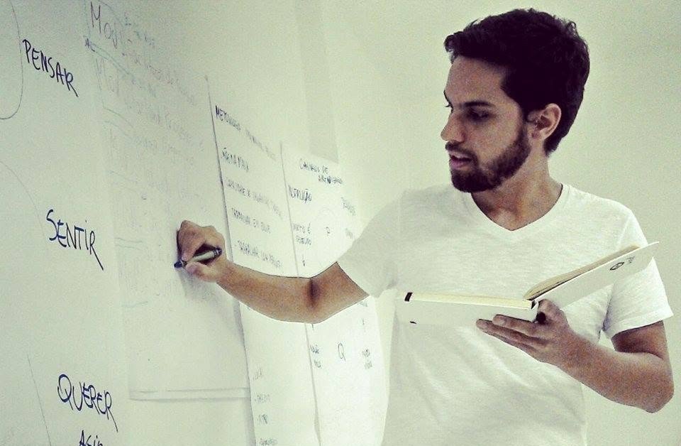Gabriel writing on a flipchart
